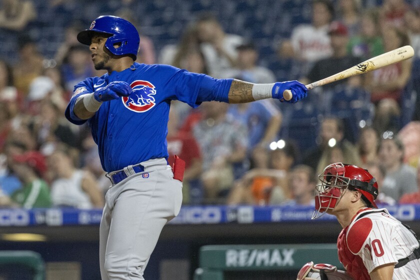 Chicago Cubs' Nelson Velazquez follows through on a two-run home run during the eighth inning of the team's baseball game against the Philadelphia Phillies, Friday, July 22, 2022, in Philadelphia. (AP Photo/Laurence Kesterson)