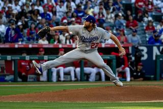 ANAHEIM, CA - JUNE 20, 2023: Los Angeles Dodgers starting pitcher Clayton Kershaw (22) throws against the Angels in the first inning at Angel Stadium on June 20, 2023 in Anaheim, California. (Gina Ferazzi / Los Angeles Times)