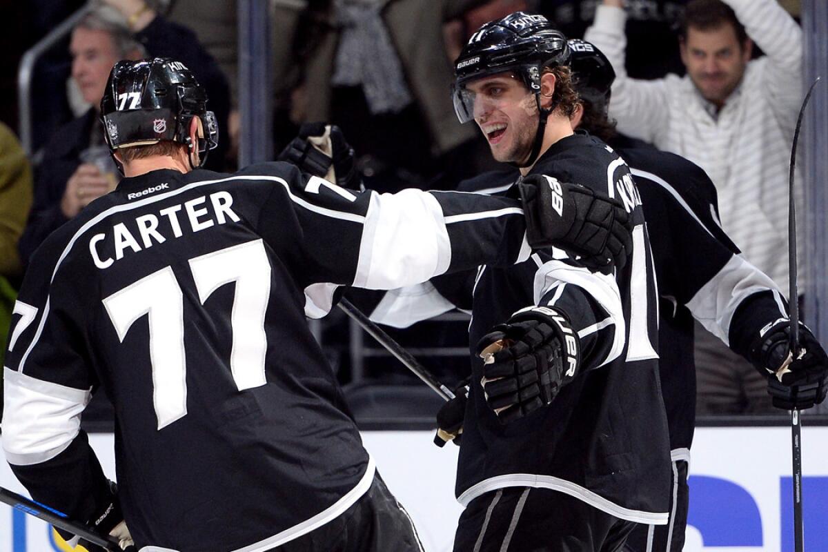 Kings center Anze Kopitar celebrates a goal against the Blues with teammate Jeff Carter in the second period Thursday night.