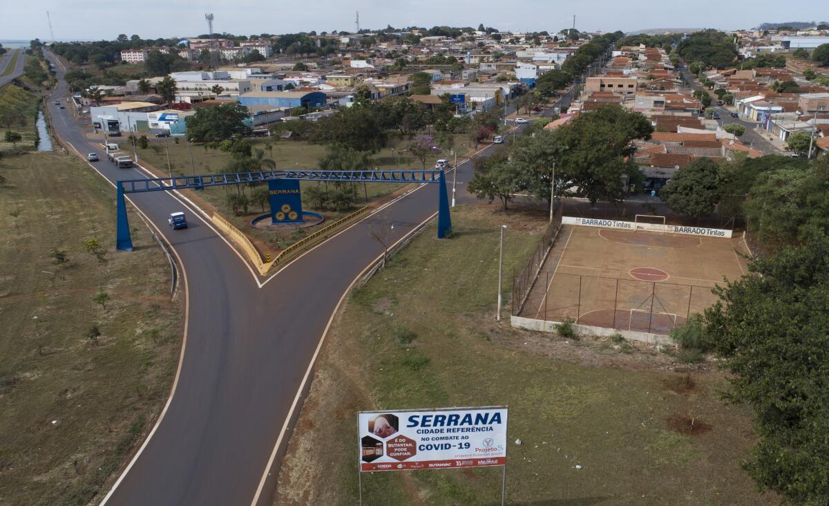 An aerial view of the entrance of Serrana, Sao Paulo state, Brazil, Friday, May 28, 2021. Brazil's Butantan Institute has finished a mass vaccination of the city's entire adult population with doses of Sinovac, to test the new coronavirus' behavior in response to the vaccine. (AP Photo/Andre Penner)