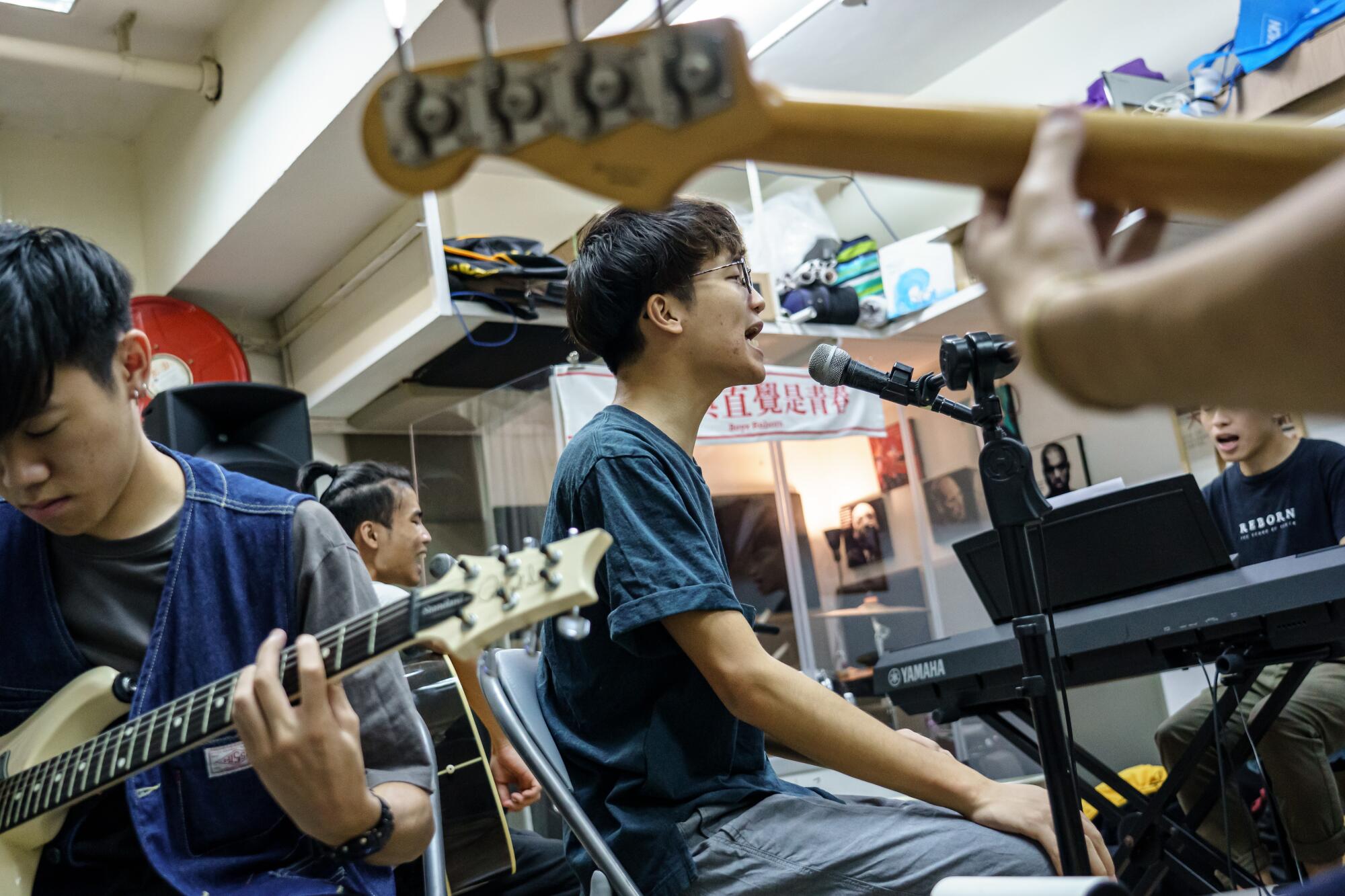 Lead singer Ben Chan and Boyz Reborn rehearse in Hong Kong. The boy band has become more political.