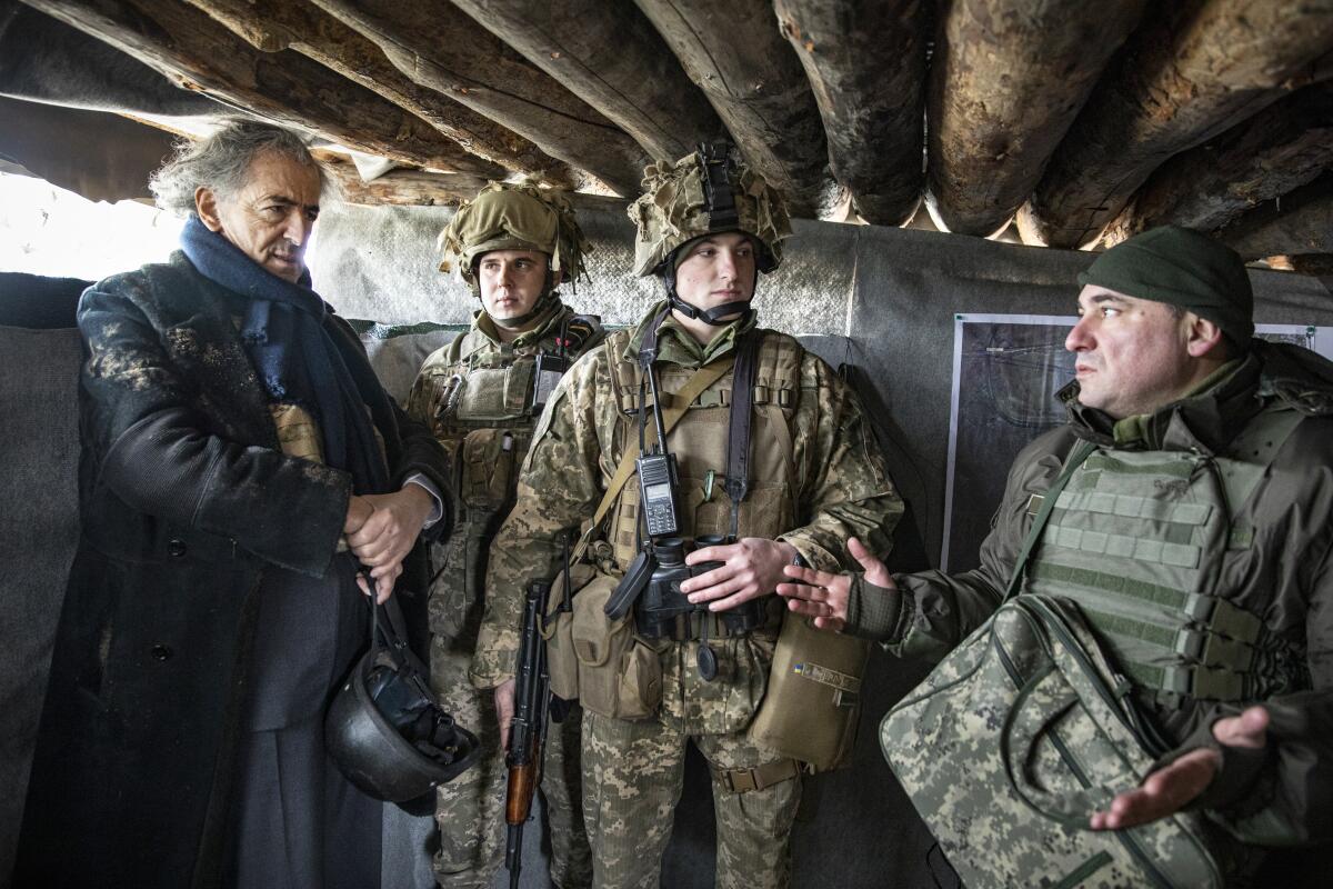 A civilian in the trenches of Donbas with Ukrainian military in the documentary “The Will to See.” 