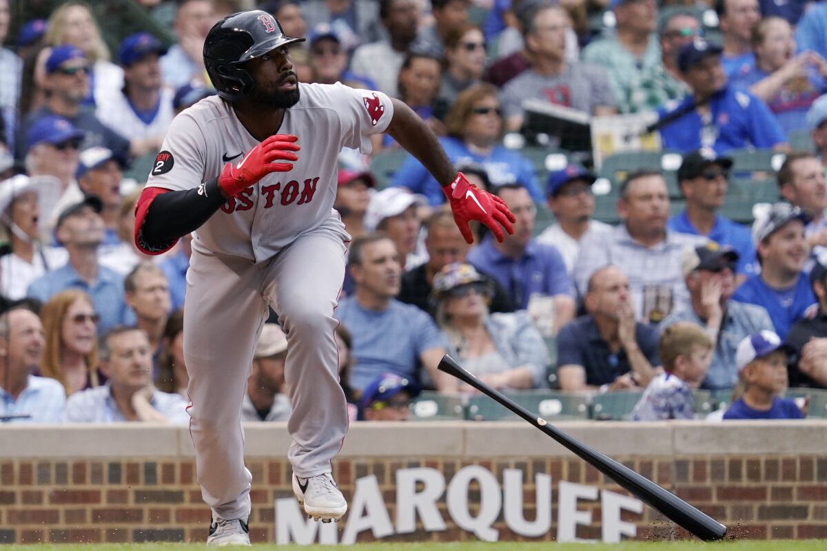 Boston Red Sox's Jackie Bradley Jr., watches after hitting a three-run double during the second inning of a baseball game against the Chicago Cubs in Chicago, Friday, July 1, 2022. (AP Photo/Nam Y. Huh)