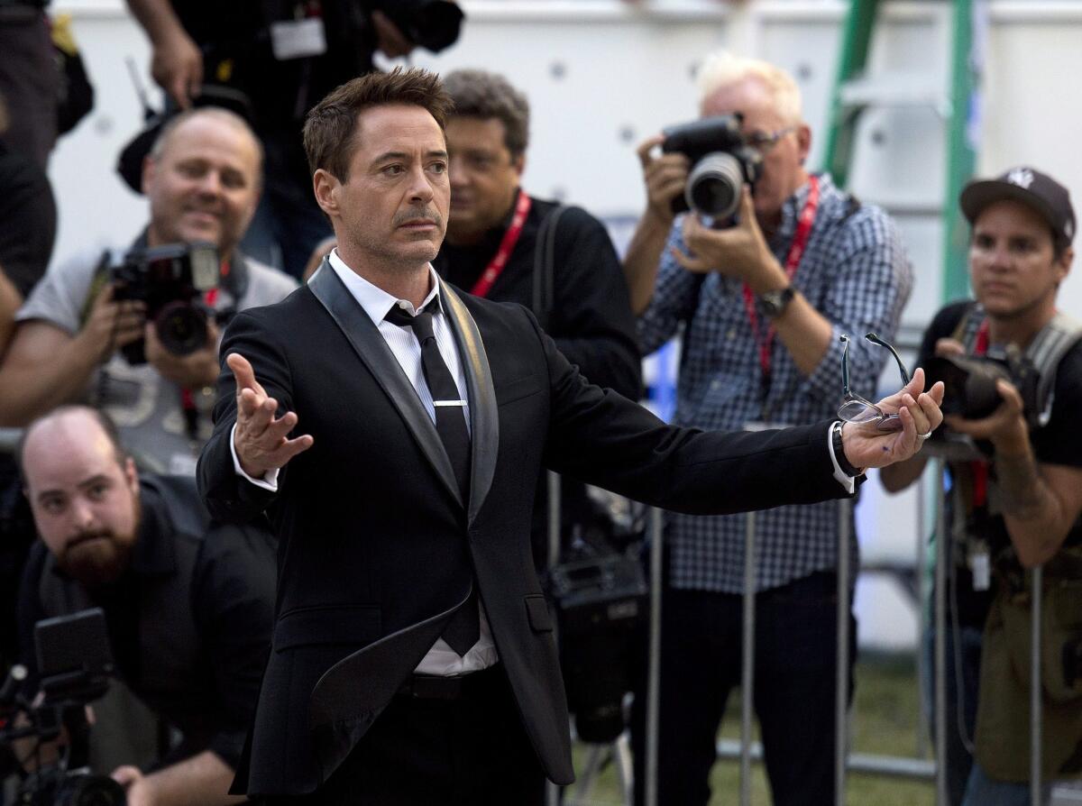 Robert Downey Jr. arrives for the premiere of his film, "The Judge," during the 2014 Toronto International Film Festival.