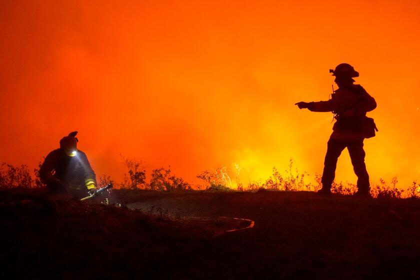 SANTA ROSA, CA - SEPTEMBER 28: Firefighters battle the Shady Fire as it makes its way towards homes along Mountain Hawk Drive in Skyhawk Park on Monday, Sept. 28, 2020 in Santa Rosa, CA. (Kent Nishimura / Los Angeles Times)