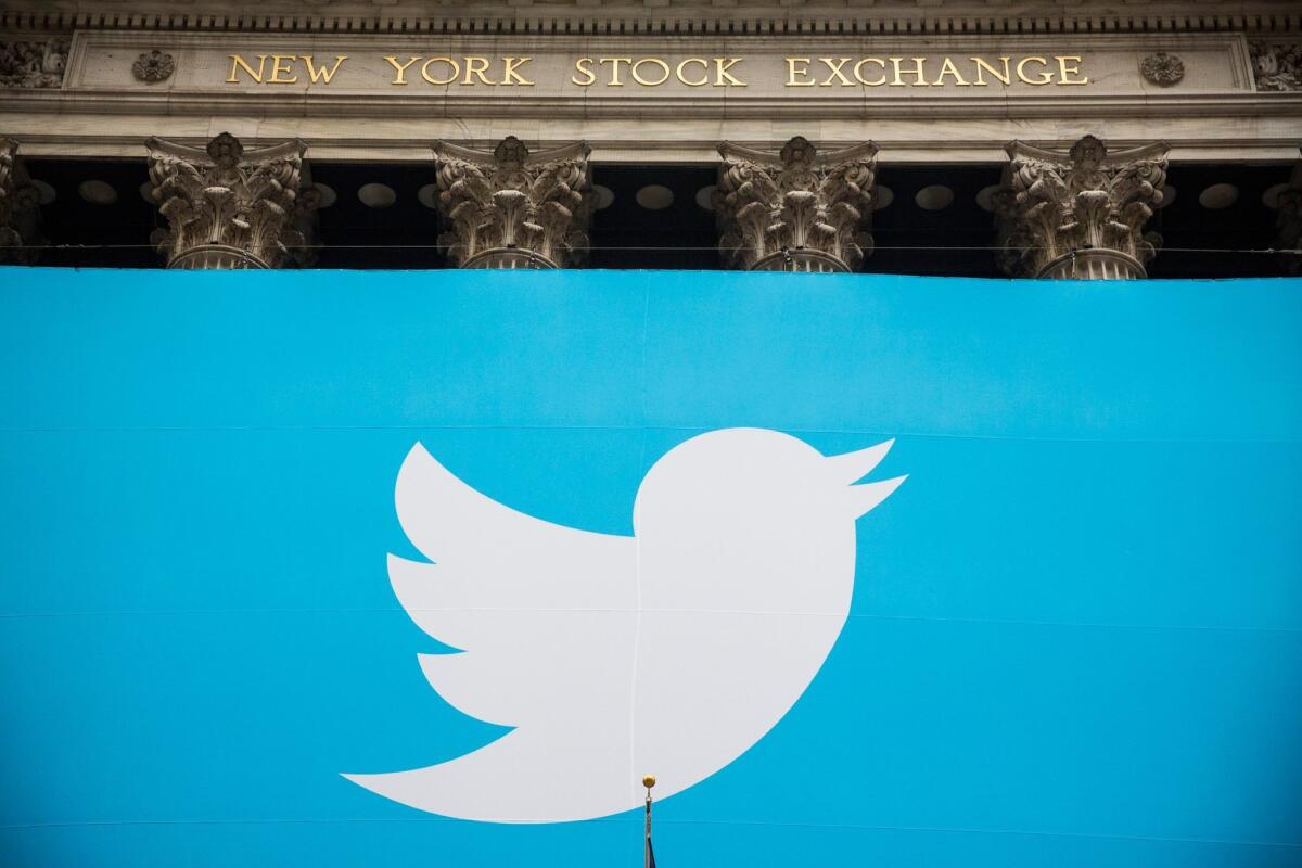 Twitter has agreed to acquire Niche, a start-up that connects advertisers with some of the social network's most-followed users. Above, Twitter's logo on a banner outside the New York Stock Exchange on Nov. 7, the day the company's stock began trading publicly.