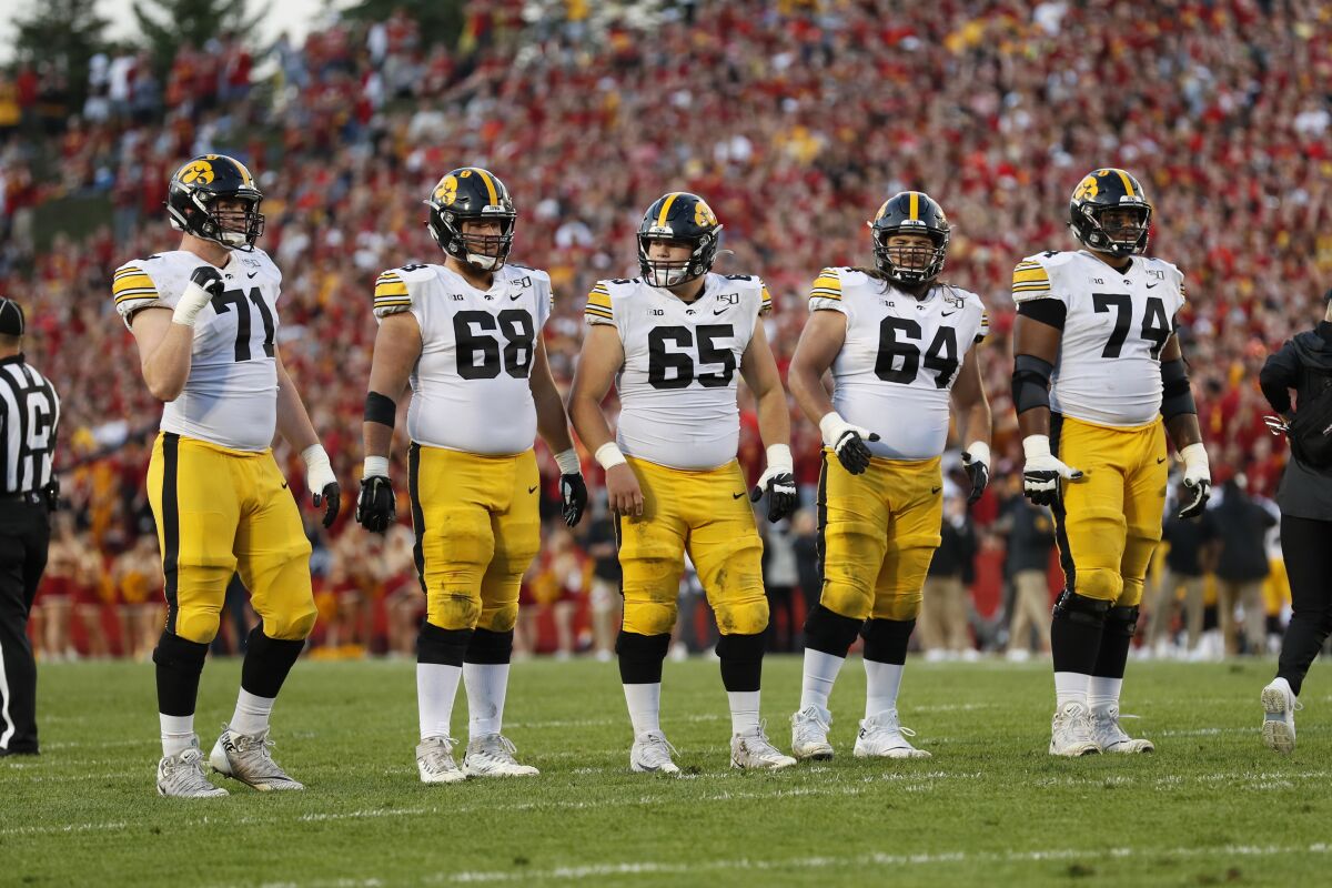Iowa offensive linemen on the field against Iowa State on Saturday.