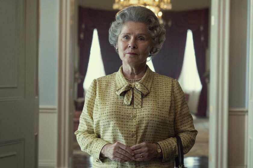 This image released by Netflix shows Imelda Staunton as Queen Elizabeth in "The Crown." (Alex Bailey/Netflix via AP)