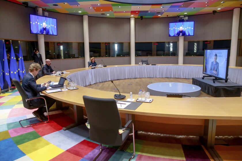 Meeting of European Union leaders around a table and by video conference.