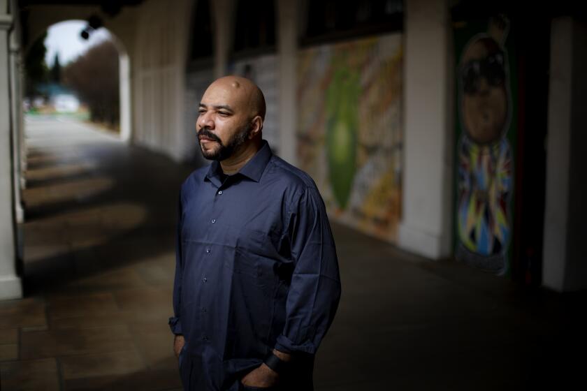 RIVERSIDE, CA - MARCH 7, 2021: John Jennings, comic book illustrator and professor of media and cultural studies at UC Riverside on March 7, 2021 in downtown Riverside, California. Black artists are using comics as a medium to address racial injustices.(Gina Ferazzi / Los Angeles Times)