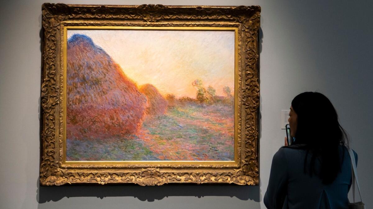 The 1890 painting "Meules" (Haystacks) by French Impressionist master Claude Monet is displayed at Sotheby's in New York.