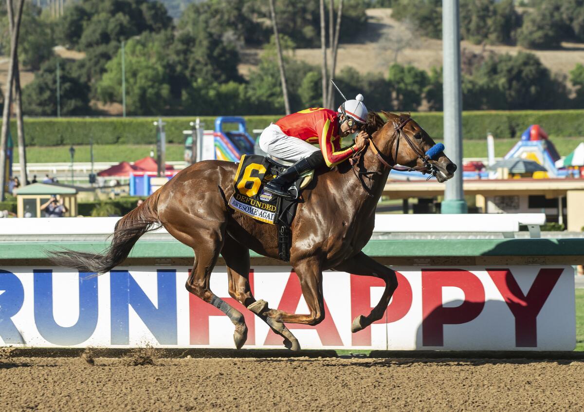 Defunded and jockey Edwin Maldonado win the $300,000 Awesome Again Stakes at Santa Anita Park on Saturday.