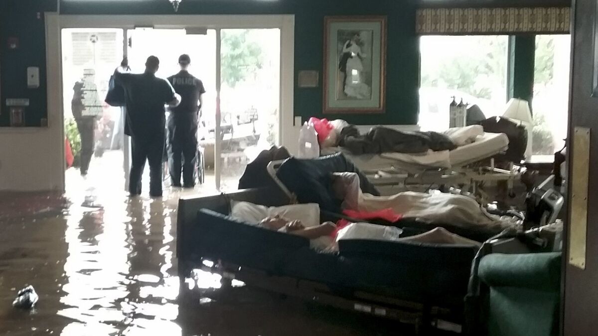 Residents lie on sofas waiting to be evacuated from the Cypress Glen nursing home in Port Arthur, Texas.