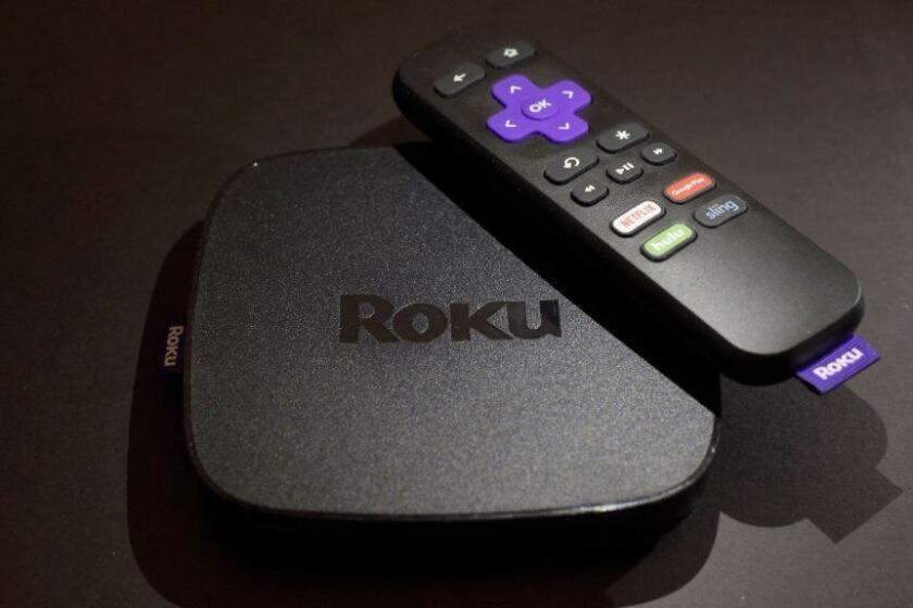 FILE - This Nov. 16, 2016 file photo shows the Roku Premiere streaming TV device in New York. Roku plans to add a voice-controlled digital assistant to expanding lineup of online video players in an attempt to catch up with Google, Apple and Amazon. The internet-connected assistant will focus exclusively on fielding spoken request about video, music and other tasks tied to entertainment. (AP Photo/Patrick Sison, File)