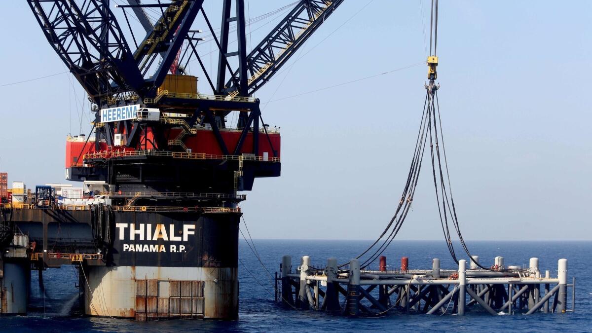 The SSCV Thialf crane vessel lays the foundation platform for the Leviathan natural gas field in the Mediterranean Sea about 80 west of Haifa, Israel, on Jan. 31.