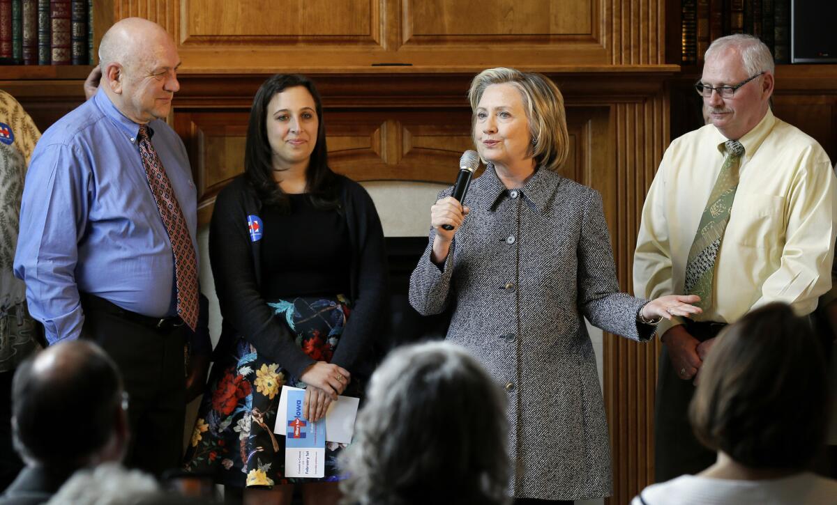 Hillary Rodham Clinton talks to supporters at a home in Mason City, Iowa.