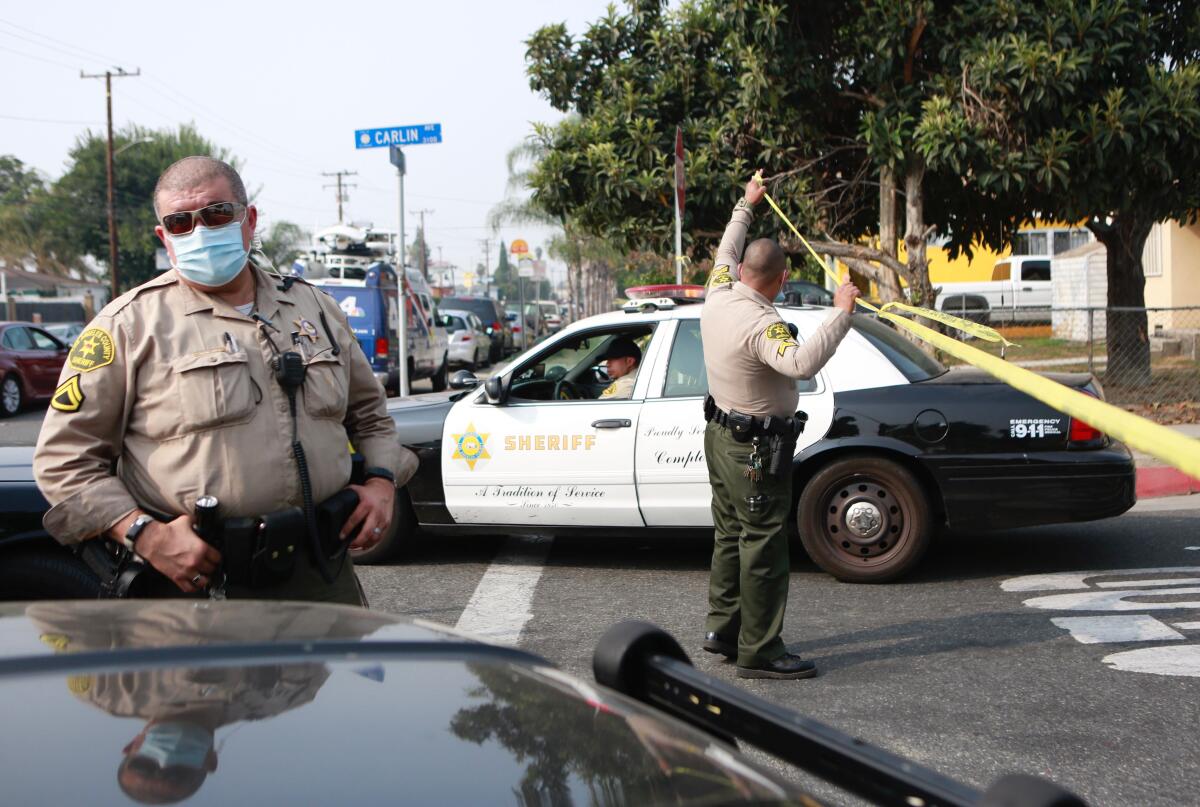 Sheriff's deputies surround a home 