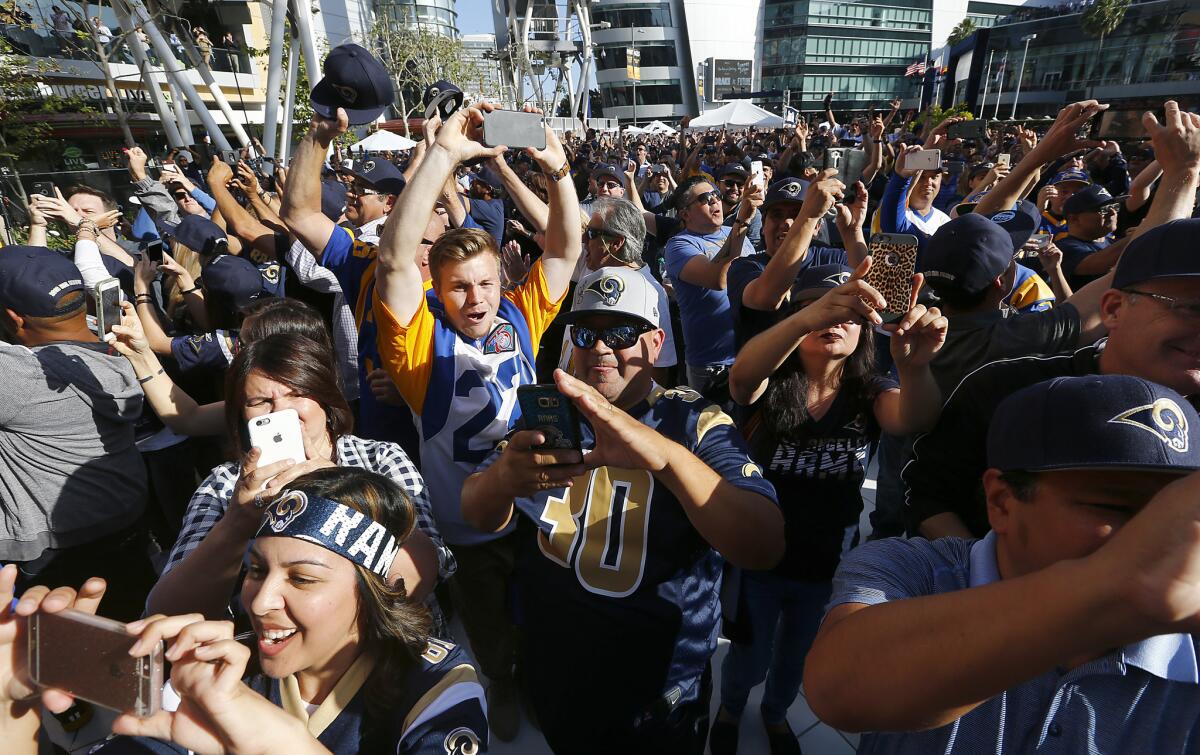 Rams fans at at L.A. Live react after watching the team's selection of quarterback Jared Goff as the No. 1 pick in the 2016 NFL draft on April 28.