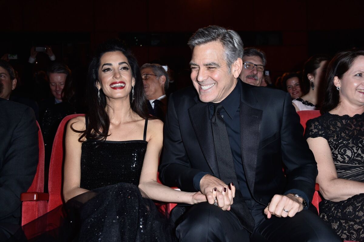 Actor George Clooney and his wife, Amal Clooney, attend the "Hail, Caesar!" premiere during the 66th Berlinale International Film Festival at Berlinale Palace on Thursday.