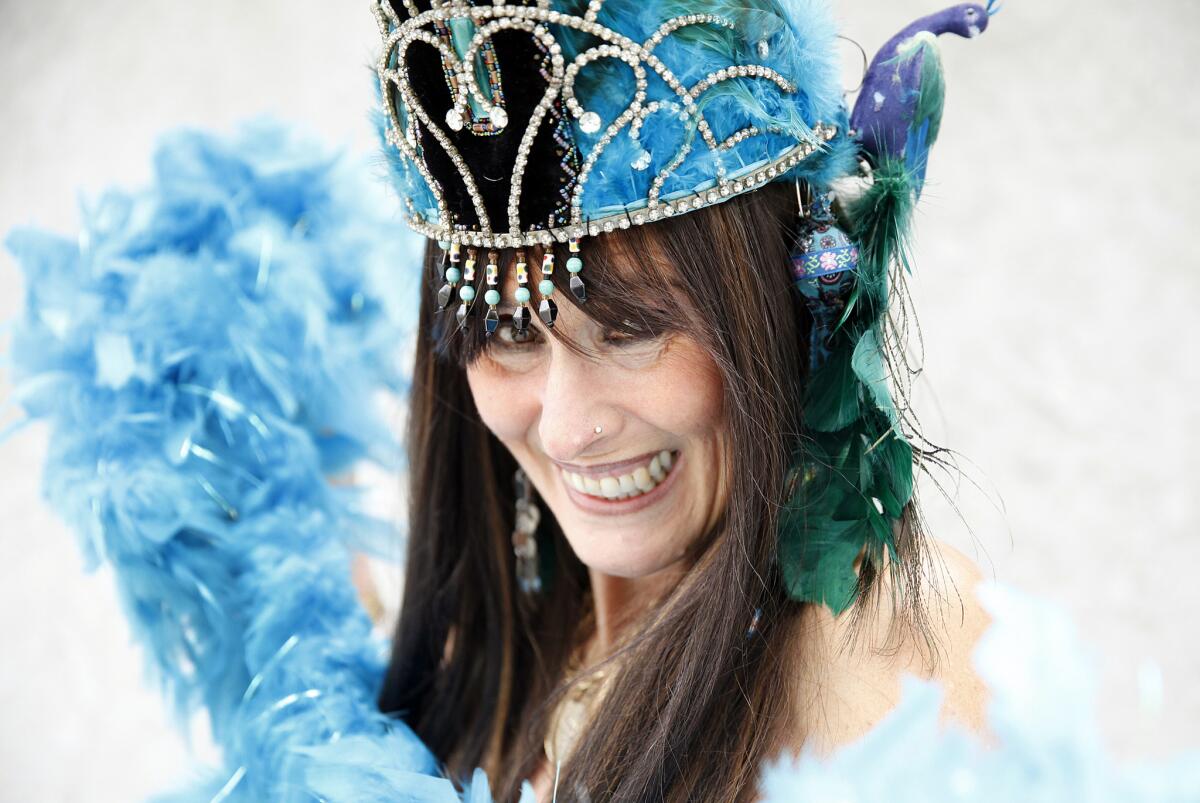 Nancy Urbach, also known as Queen Narayana, practices her belly dancing moves at her Pasadena home on the eve of her role as queen of Saturday's Pasadena Doo Dah Parade.