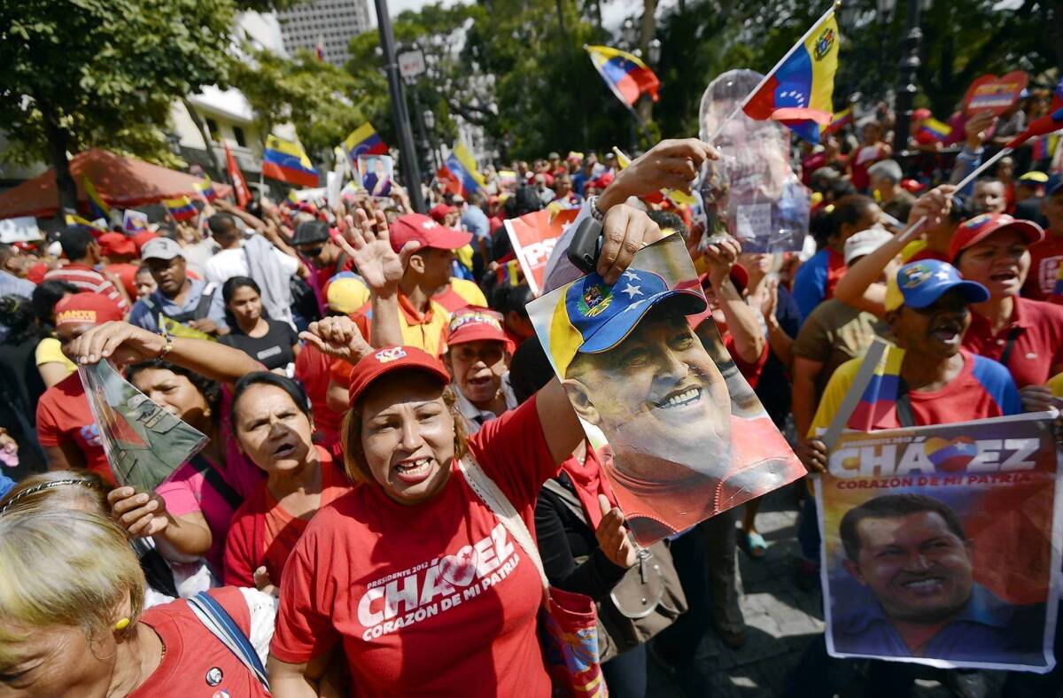 Supporters of Venezuelan President Hugo Chavez gather at Simon Bolivar Square in Caracas to celebrate his return after cancer surgery in Cuba.