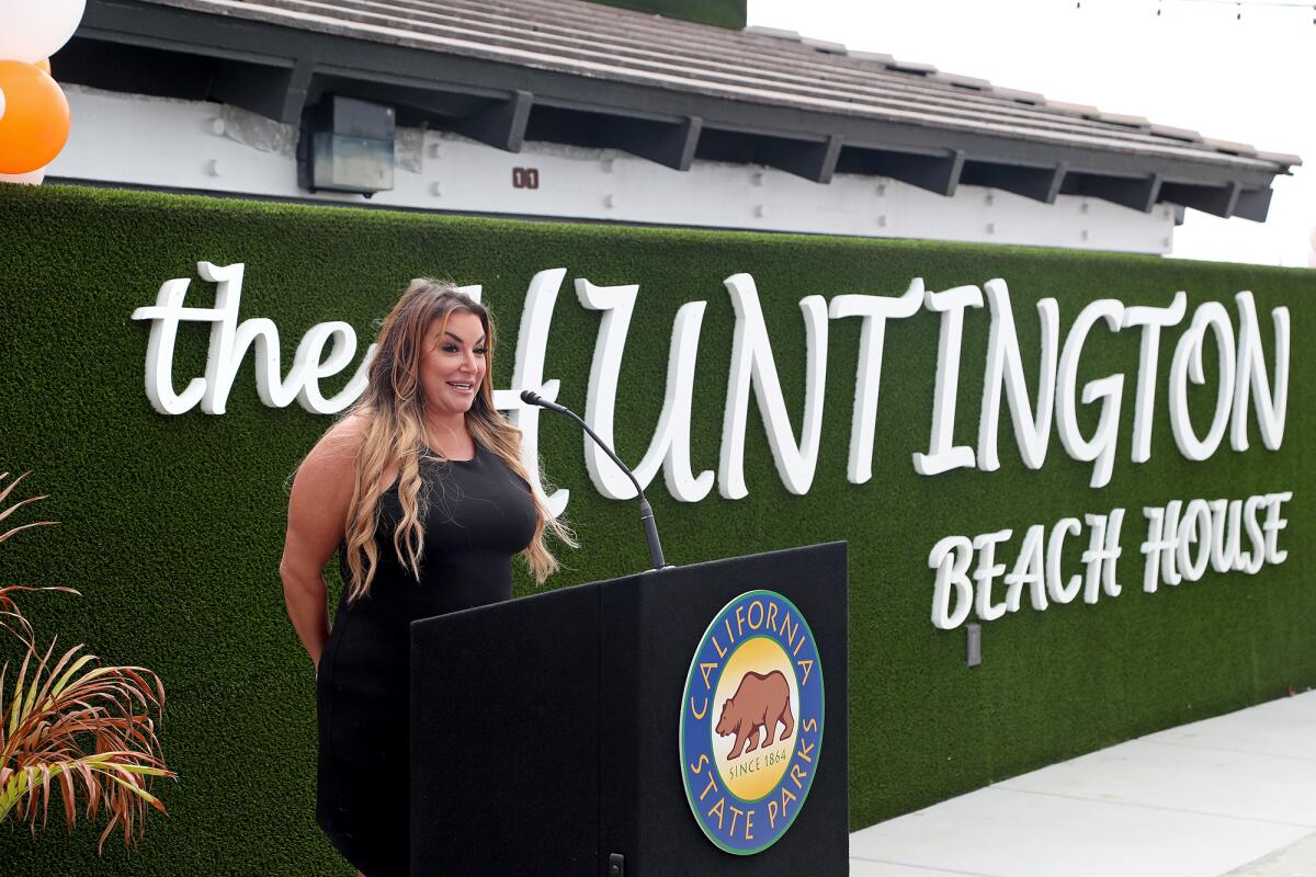 Prjkt CEO Alicia Whitney speaks during a ribbon-cutting ceremony for the Huntington Beach House on Thursday.