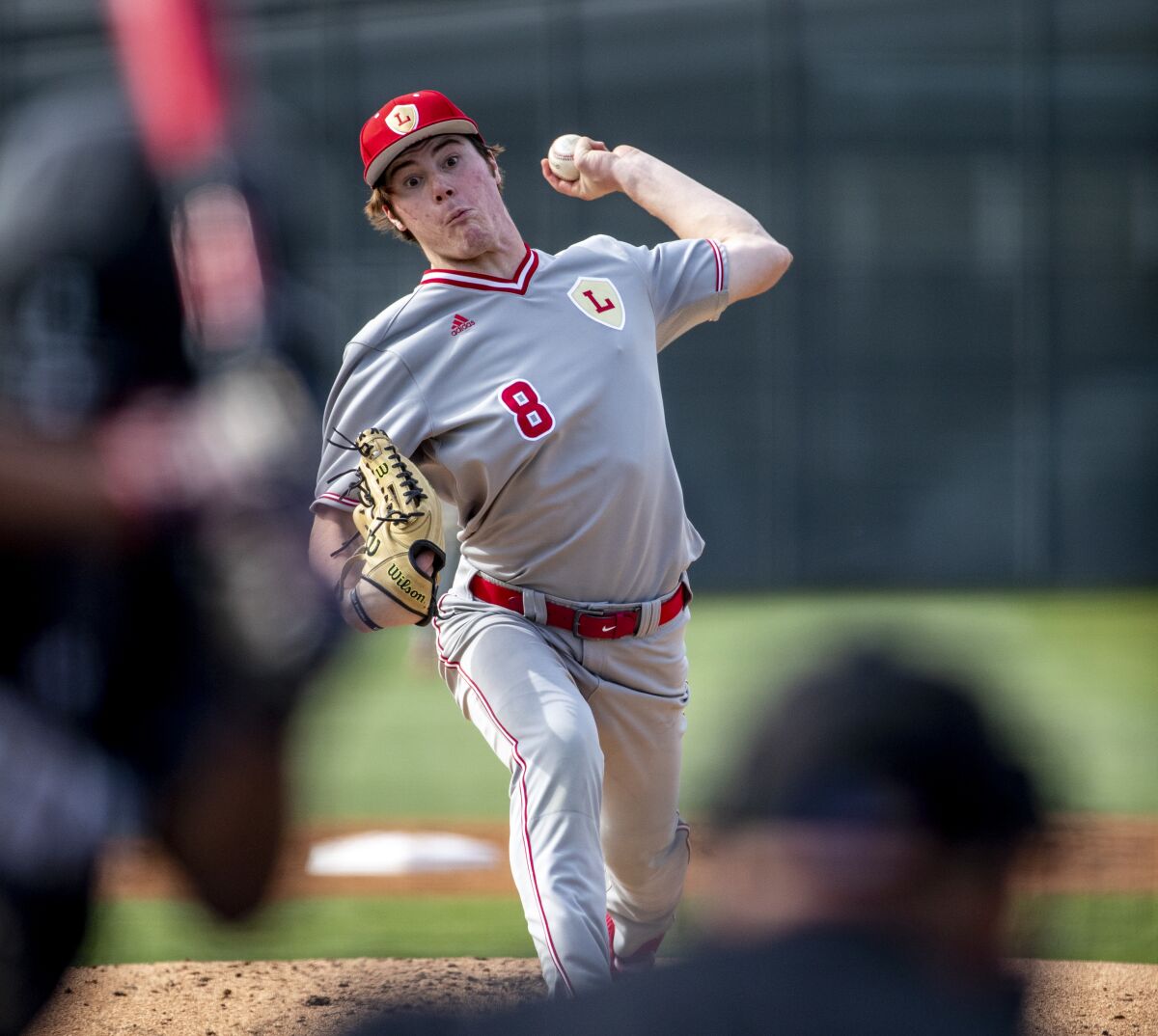Orange Lutheran pitcher Oliver Santos delivers against Servite on March 15.