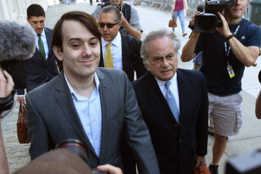 Martin Shkreli, the former Turing Pharmaceuticals executive who became known as "Pharma Bro" arrives for the first day of jury selection in his federal securities fraud trial June 26, 2017 at United States District Court Eastern District of New York in Brooklyn. At right is his lawyer Ben Brafman. / AFP PHOTO / TIMOTHY A. CLARYTIMOTHY A. CLARY/AFP/Getty Images ** OUTS - ELSENT, FPG, CM - OUTS * NM, PH, VA if sourced by CT, LA or MoD **