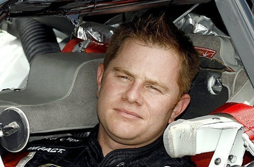 Jason Leffler, a four-time USAC national champion in Midget and Silver Crown divisions, sits in his car before a qualifying run at Daytona International Speedway.