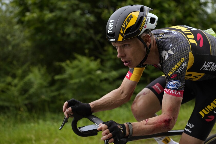 German Tony Martin rides with injuries on the arm after a crash during the first stage of the Tour de France cycling race over 197.8 kilometers (122.9 miles) with start in Brest and finish in Landerneau, France, Saturday, June 26, 2021. (AP Photo/Daniel Cole)