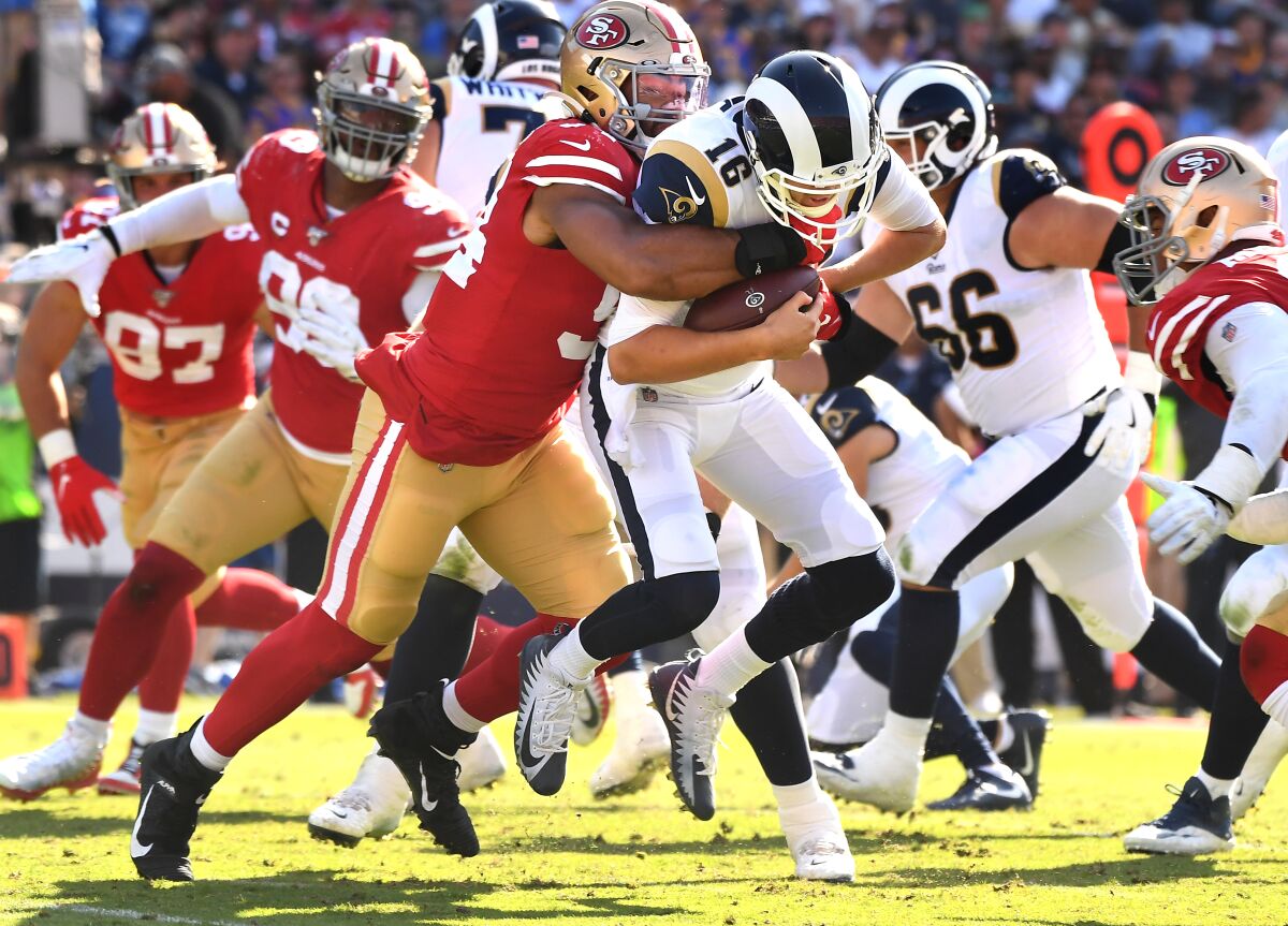 Rams quarterback Jared Goff is sacked by 49ers defensive lineman Solomon Thomas.