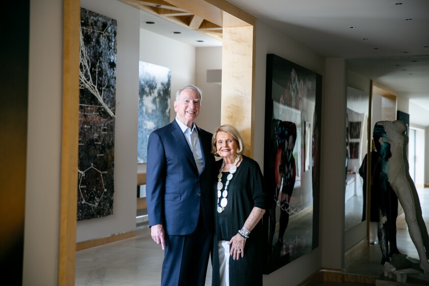 Irwin Jacobs, founding chairman of Qualcomm, and his wife, Joan, are pictured at their home in 2019.