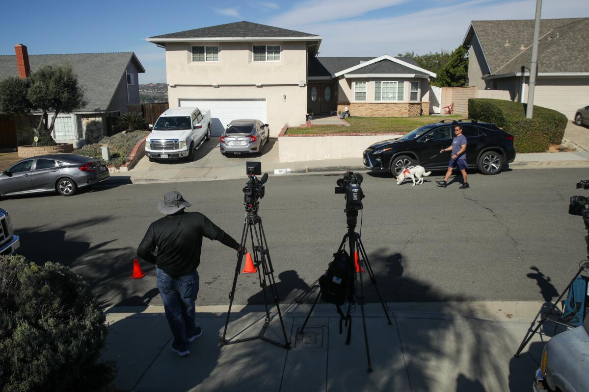 Media gather in front of the home of Nicholas Joseph Gutierrez in Diamond Bar.