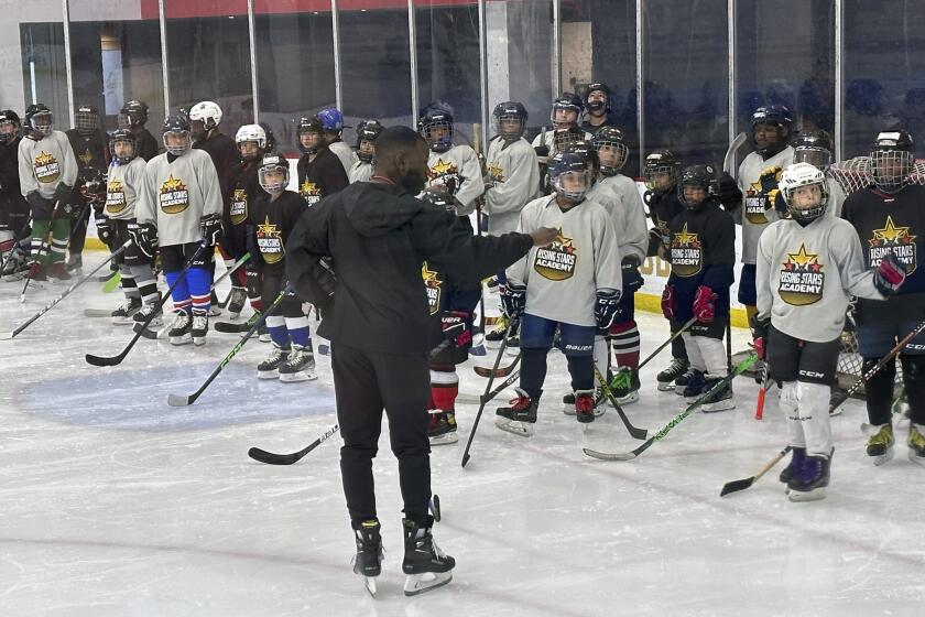FILE - Duanté Abercrombie speaks to players as an instructor at the Washington Capitals' inaugural Rising Stars Academy in Arlington, Va., Aug. 20, 2023. Tennessee State has taken its biggest step yet toward becoming the first historically Black college and university to introduce ice hockey by hiring Abercrombie as coach. (AP Photo/Stephen Whyno, File)