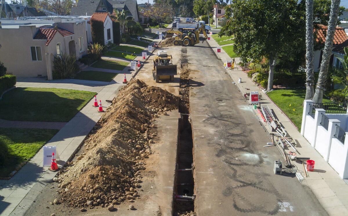 Crews from Maxim Engineering work to install new sewer pipes on Golden Gate Drive in University Heights on Tuesday, January 28, 2020.