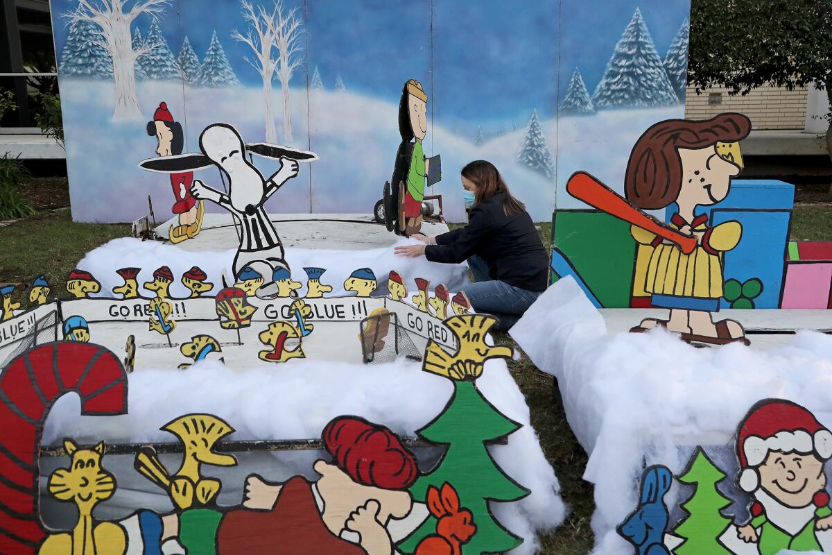 City staff work on setting up Snoopy House Wednesday at Costa Mesa City Hall.