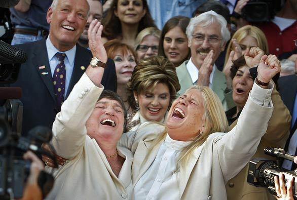 Robin Tyler, left, and Diane Olson rejoice after marrying in a Jewish ceremony in Beverly Hills. Together 15 years, they were the original plaintiffs in the 2004 California lawsuit challenging the ban on gay marriage as unconstitutional.