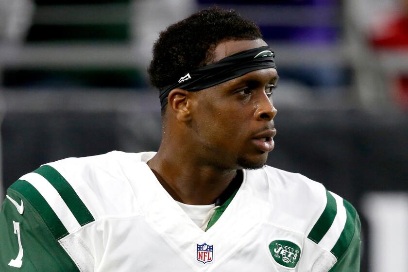 New York Jets quarterback Geno Smith looks on before a game against Arizona on Oct. 17.