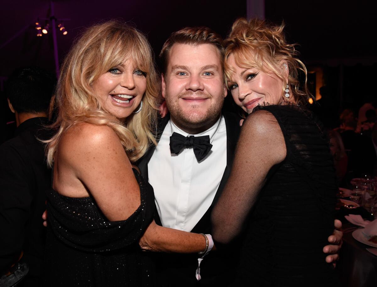 Goldie Hawn, from left, event host James Corden and Melanie Griffith attend the amfAR Gala Los Angeles at Ron Burkle's Greenacres estate in Beverly Hills.