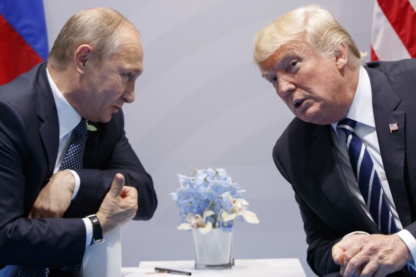 FILE - In this Friday, July 7, 2017, file photo U.S. President Donald Trump meets with Russian President Vladimir Putin at the G-20 Summit in Hamburg. The Kremlin and the White House have announced Thursday, June 28, 2018, that a summit between Russian President Vladimir Putin and U.S. President Donald Trump will take place in Helsinki, Finland, on July 16. (AP Photo/Evan Vucci, File)