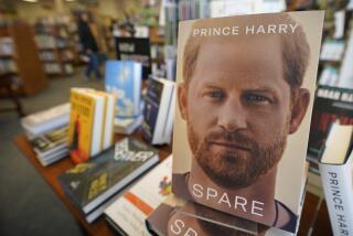 A book stands upright on a table full of other titles