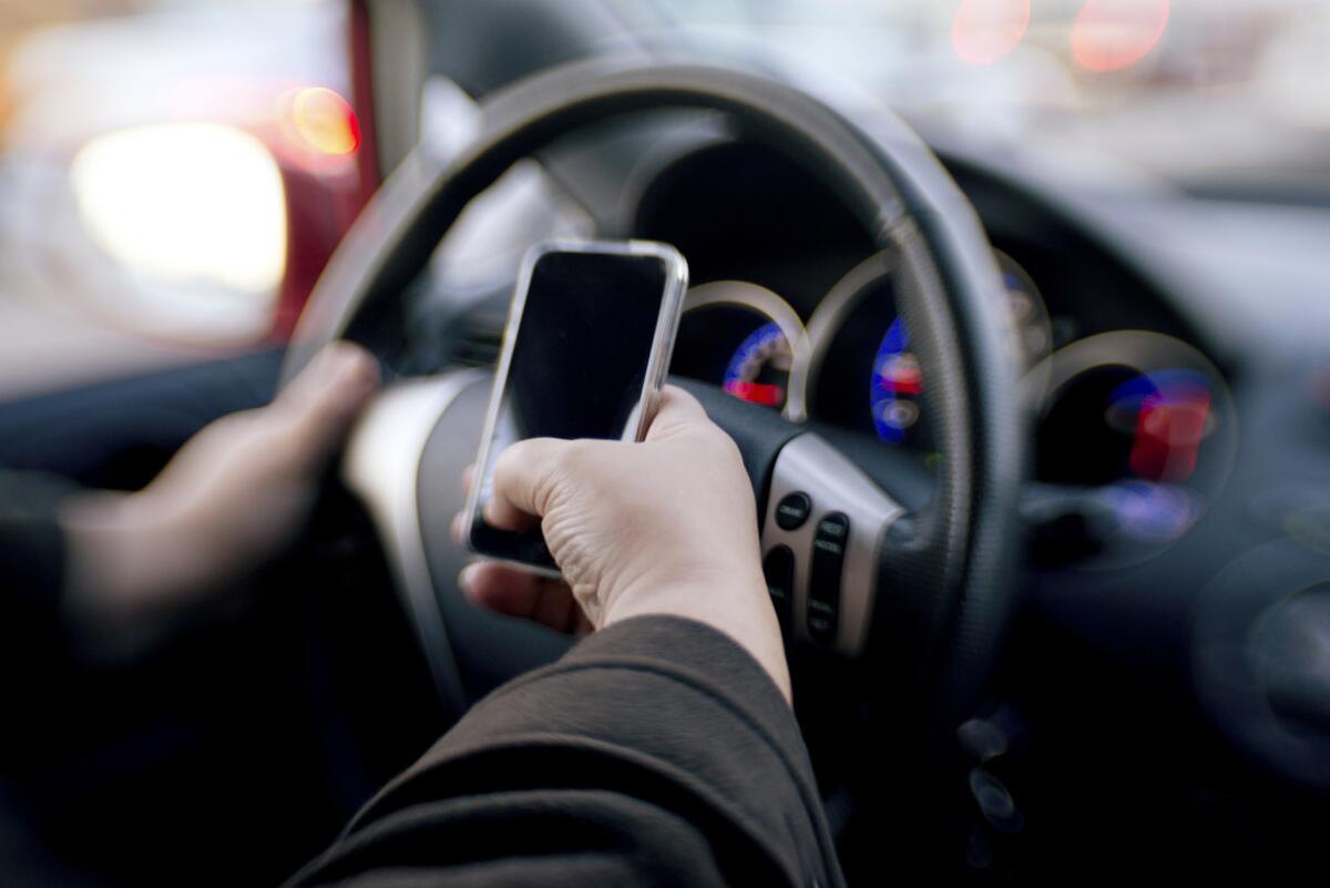 A recent NerdWallet study found that 67% of Americans surveyed who had driven in the last 12 months had used a cellphone while driving during that time. (Rouzes / Getty Images/iStockphoto)