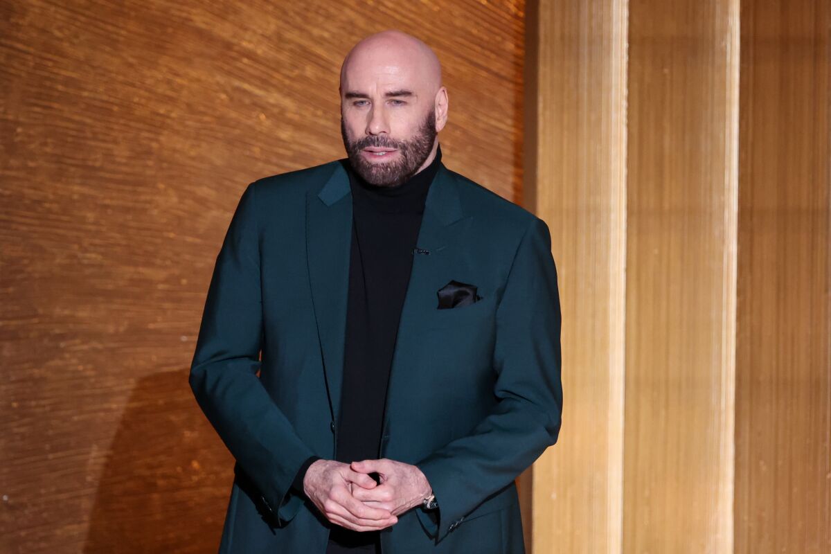 A man in a teal suit.