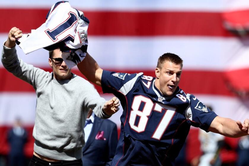 BOSTON, MA - APRIL 3: Rob Gronkowski of the New England Patriots steals Tom Brady's jersey before the opening day game between the Boston Red Sox and the Pittsburgh Pirates at Fenway Park on April 3, 2017 in Boston, Massachusetts. (Photo by Maddie Meyer/Getty Images) *** BESTPIX *** ** OUTS - ELSENT, FPG, CM - OUTS * NM, PH, VA if sourced by CT, LA or MoD **