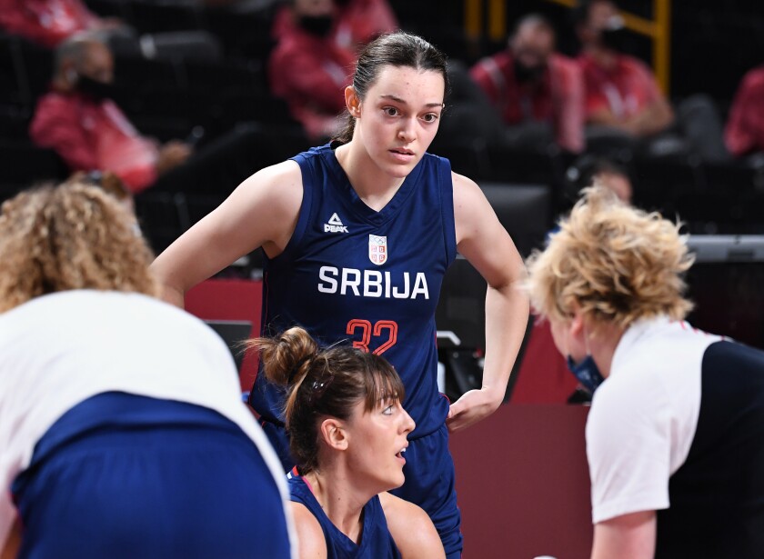 Serbia's Angela Dugalic listens to her coach during a timeout against the U.S. on Friday.