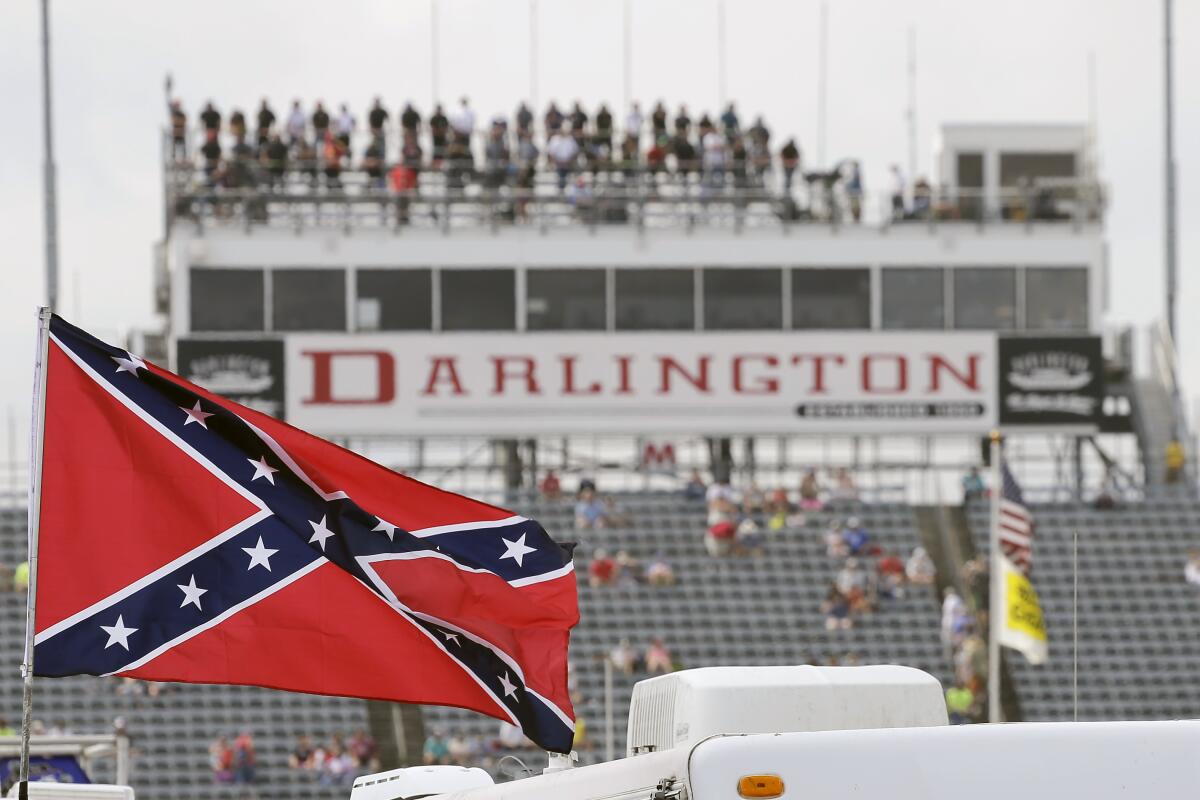 A Confederate flag flies in the infield at Darlington Raceway before a NASCAR Xfinity Series race Sept. 5, 2015. 