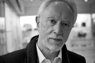 An older man standing in a thin jacket and white dress shirt in black and white.