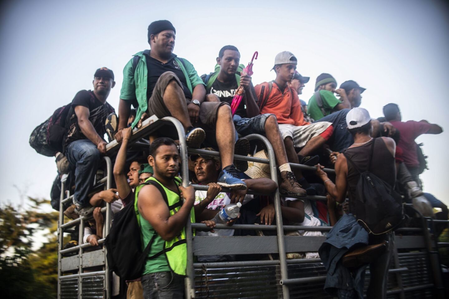 Honduran migrants heading in a caravan to the U.S., travel aboard a truck near Mapastepec, Mexico.