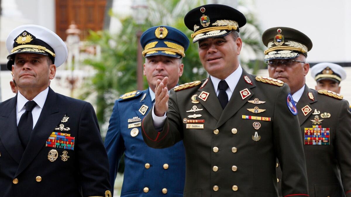 Venezuela's defense minister, Vladimir Padrino Lopez, arrives for a session of the constitutional assembly accompanied by a group of military commanders in Caracas on Aug. 8, 2017.
