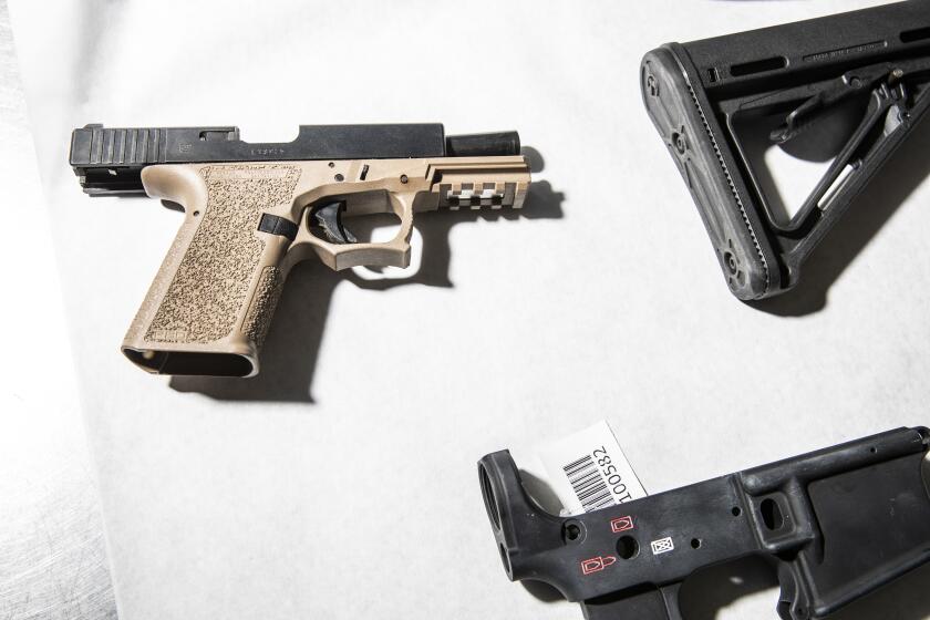 SAN FRANCISCO, CA - April 15: A semi-automatic pistol with a 80% polymer lower frame, is seen among a sample of ghost guns seized by the Oakland Police Department, at the department's Property and Evidence Unit in Oakland, California Thursday, April 15, 2021. (Stephen Lam/The San Francisco Chronicle via Getty Images)